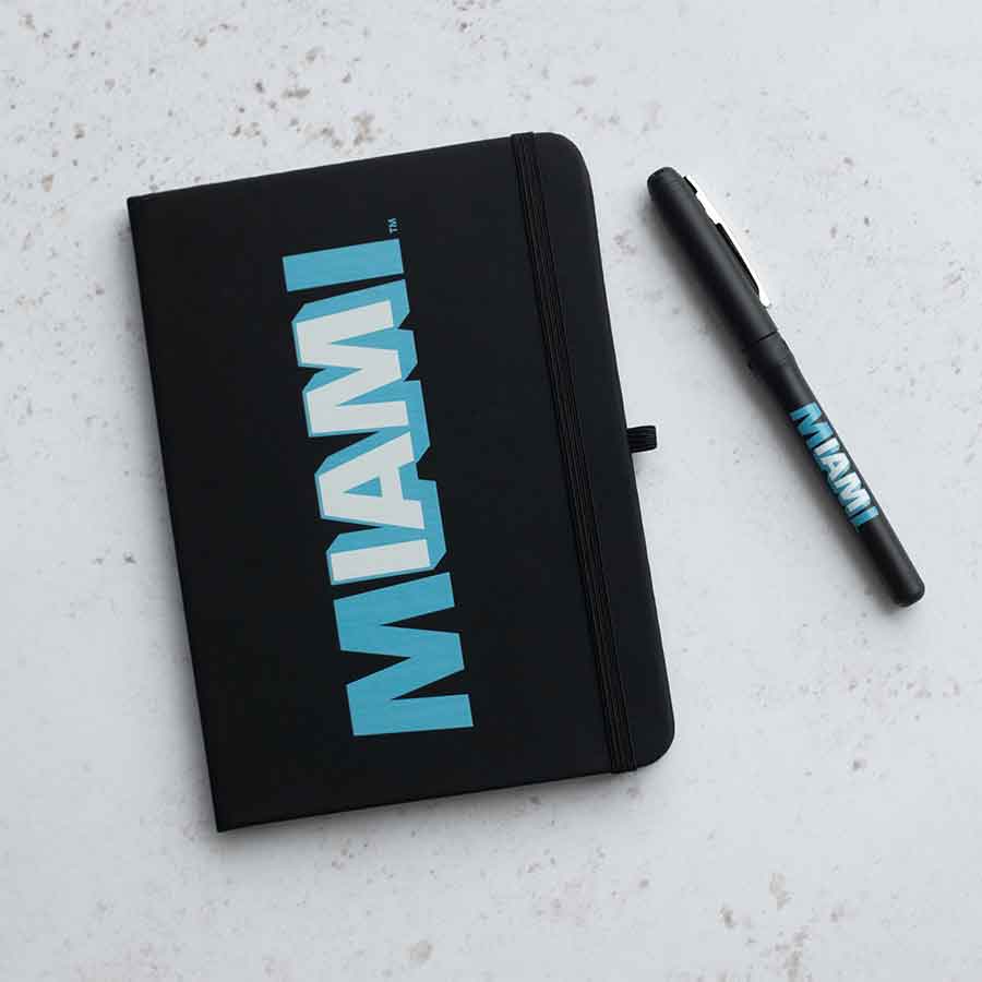 The black Flagler Miami notebook with the I AM MIAMI logo on the hardcover