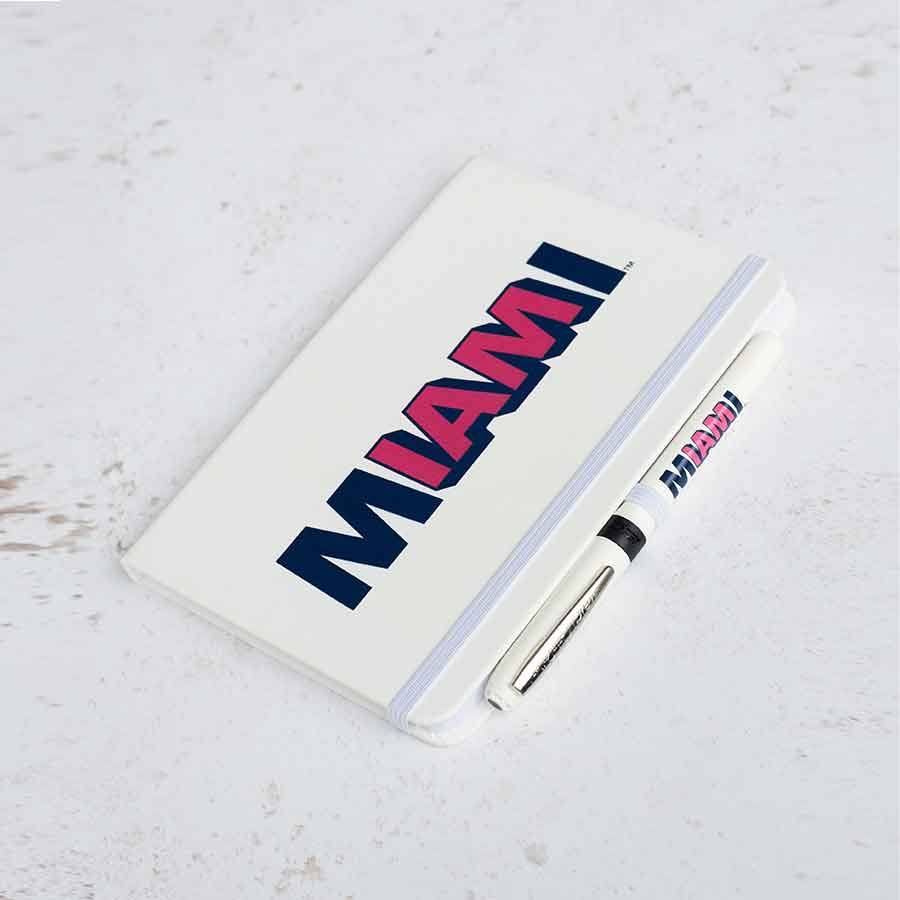 The white Flagler Miami notebook, A5 hardcover with the I AM MIAMI logo