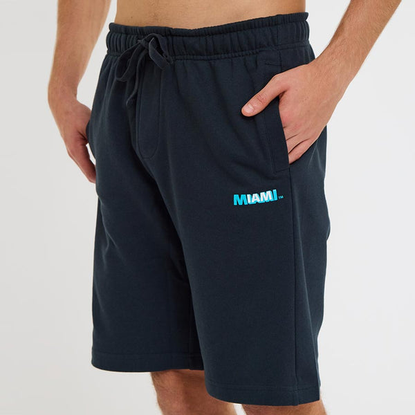 Man wearing the black Ocean Drive Miami shorts with elastic drawstring waist and side pockets